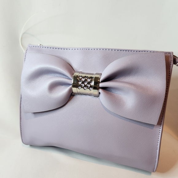Betsey Johnson Handbags - BETSY JOHNSON NWOT, Lavender Bow wristlet/clutch with silver tone hardware